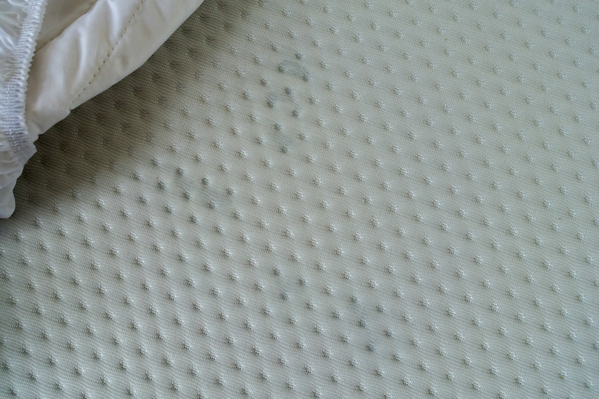 water on mattress cover